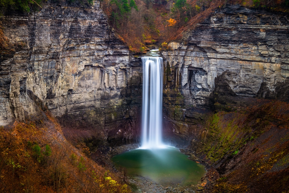 Finger Lakes Waterfalls, shot of a tall waterfall cascading down a huge gorge